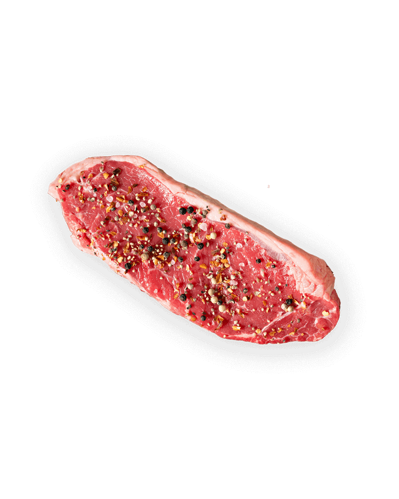 Contre-filet de bœuf cru mariné, recouvert de poivres.